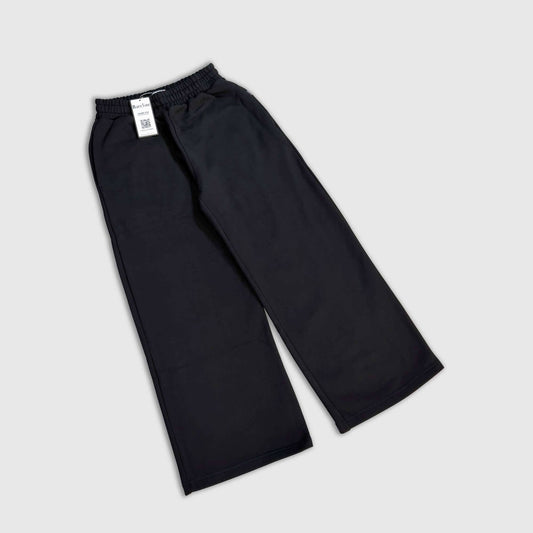 Person styled in Bareline Clothing basics, emphasizing simplicity and comfort