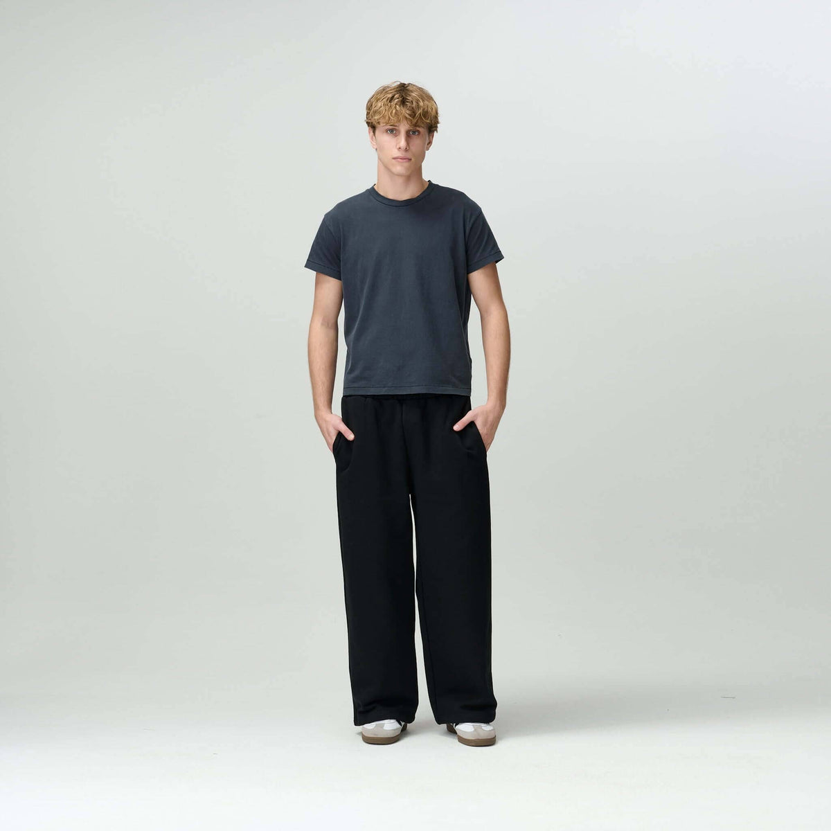 Person styled in Bareline Clothing basics, emphasizing simplicity and comfort