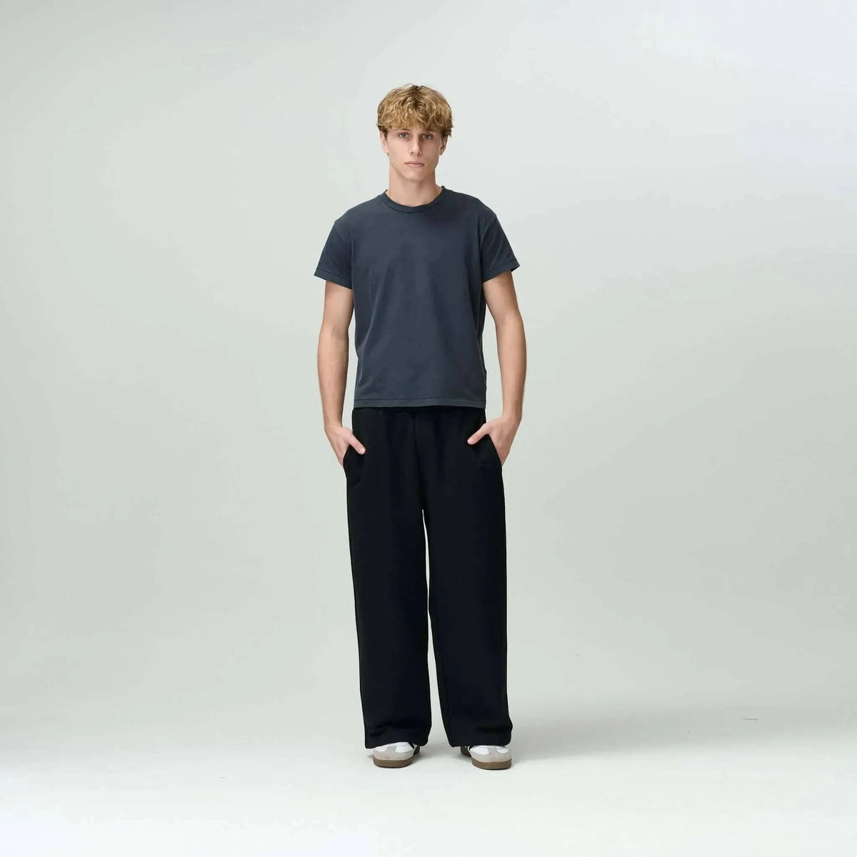 Person styled in Bareline Clothing basics, emphasizing simplicity and comfort